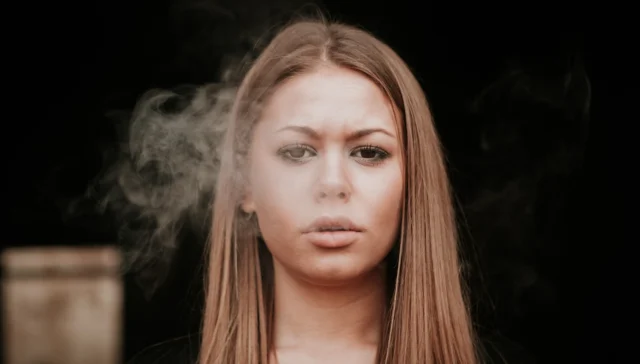 woman smoking drugs; how long do drugs stay in your system