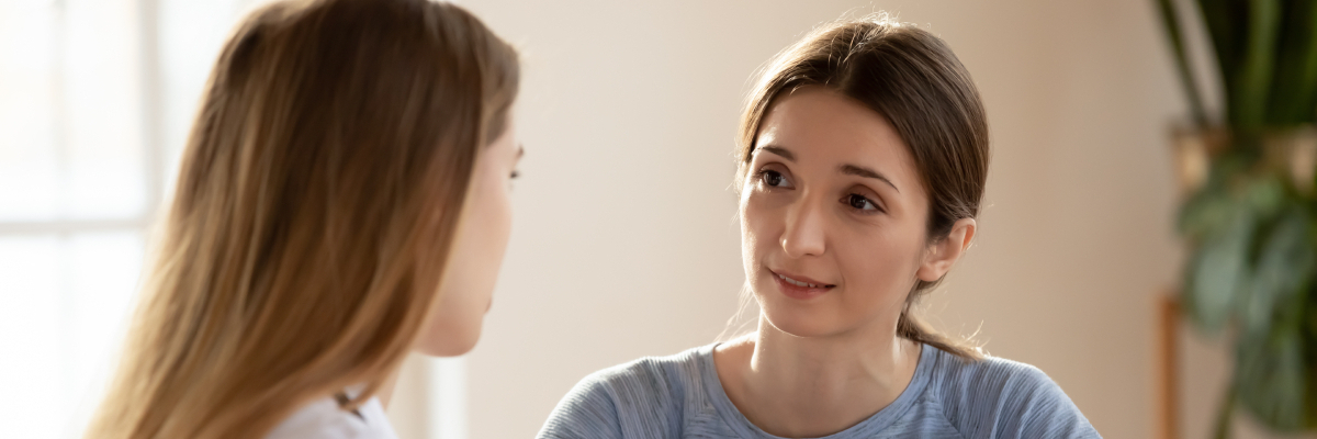 Person reviewing insurance documents with an advisor while choosing a rehab that takes their insurance