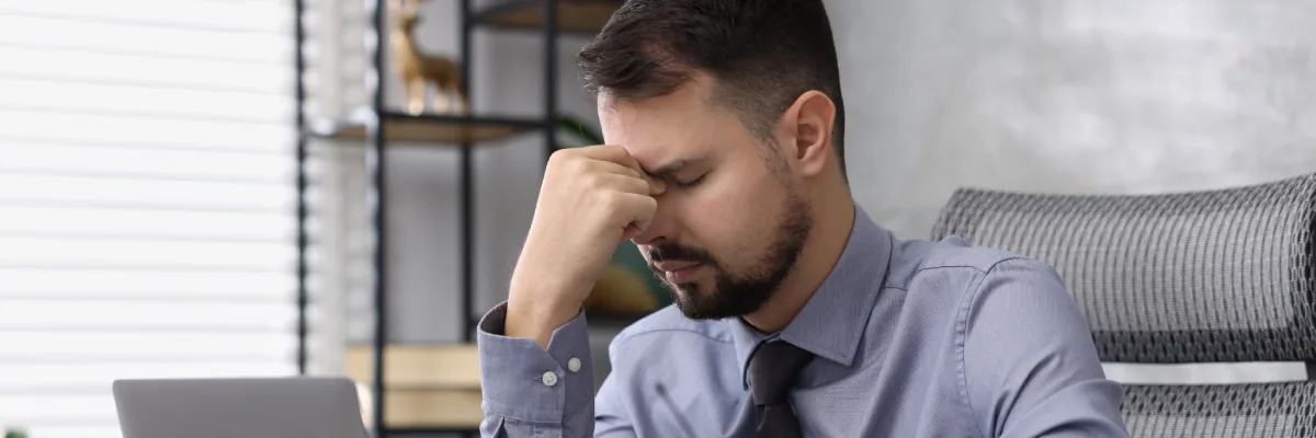 Working adult tired after not reviewing a PHP schedule and FMLA paperwork while balancing job responsibilities with treament